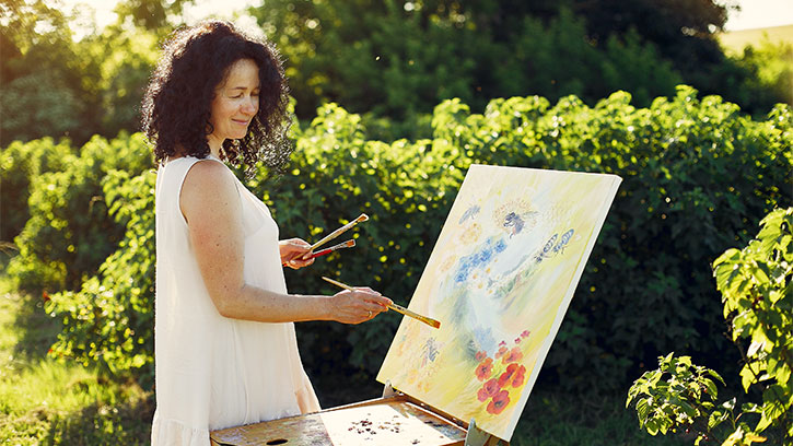 woman painting outdoors